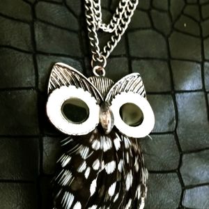 Silver plated necklace with brown,black, and white, spotted feather owl pendant